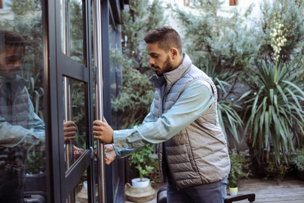 istock A young man unlocking and entering the rented apartment 1490431337