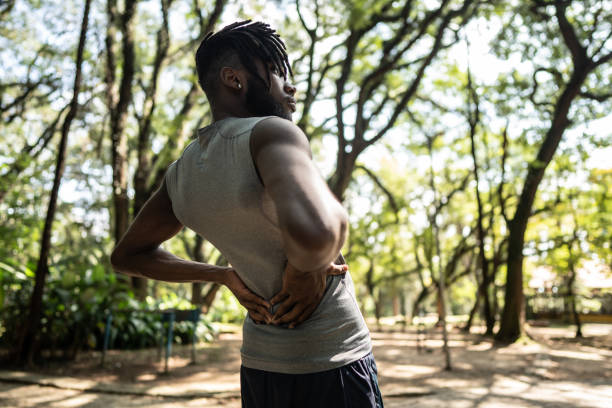 istock Young man stretching in the park 1490431724