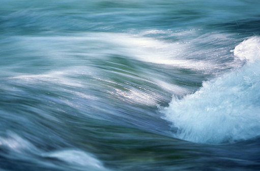 close up of fast flowing stream in the morning