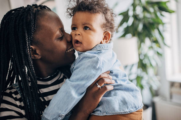 istock Mom holding her baby boy 1490433500