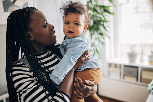 istock Mom holding her baby boy 1490433590