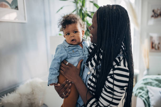 istock Mother holding her baby boy 1490433668