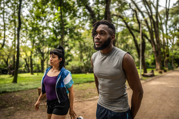 istock Friends walking in the park 1490433793