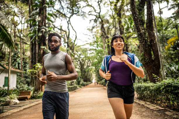 istock Friends running in the park 1490433868
