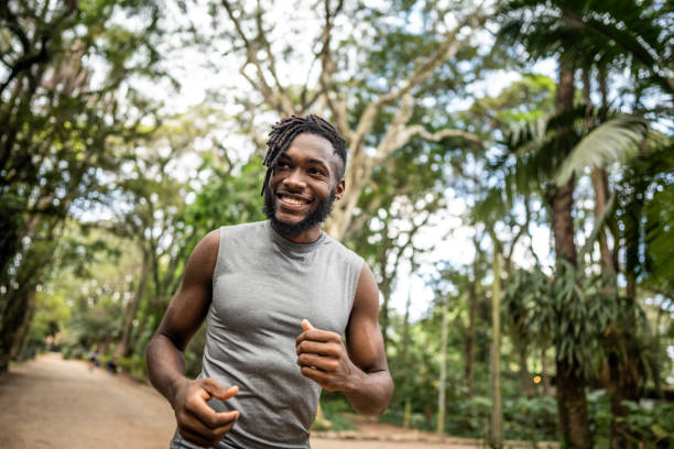 istock Young man running in the park 1490433973