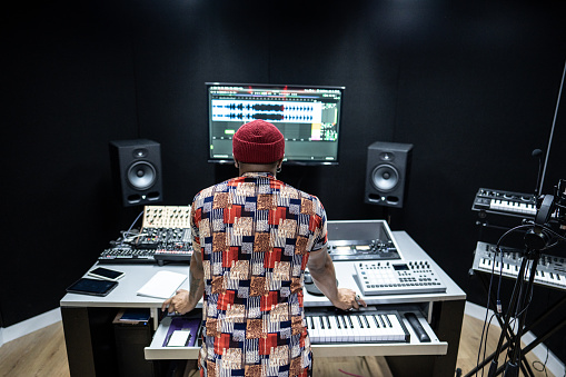 Producer man analyzing the recording in the a recording studio