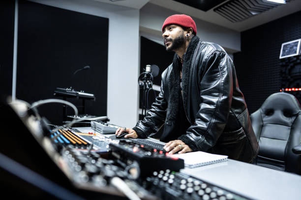 istock Producer man using a sound mixer in the recording studio 1490436490