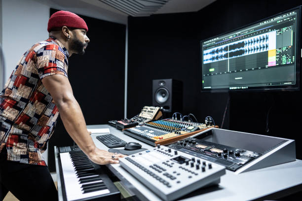istock Producer man analyzing the recording in the a recording studio 1490436514