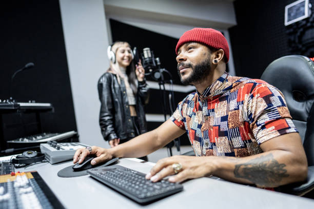 istock Producer man using a sound mixer in the recording studio 1490436549