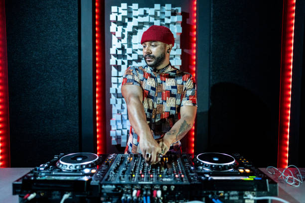 istock Dj man playing musics in a nightclub 1490436737