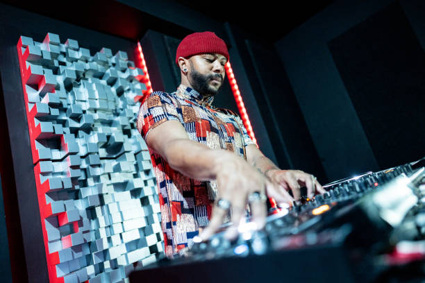 istock Dj man playing musics in a nightclub 1490436753