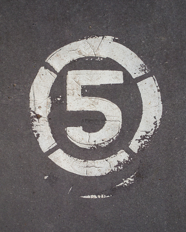 Number five painted on the pavement