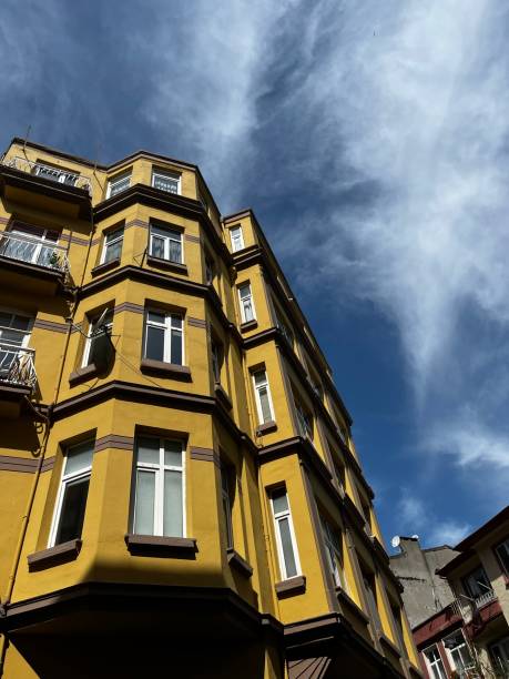 istock Yellow building with blue sky contrast 1490439218