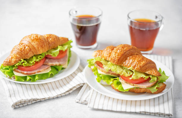 istock Meat cheese tomato croissant for breakfast 1490439255