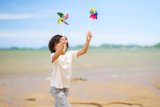 istock Happy boy playing and running on beach, Summer beach travel 1490440986
