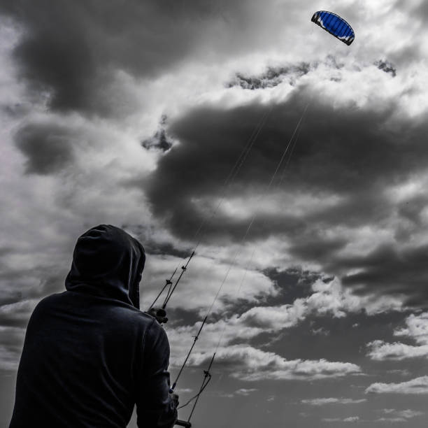 istock Kite flying against moody sky 1490441101