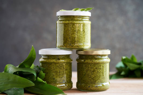 istock Bottled wild garlic pesto with fresh ramson leaves 1490441637