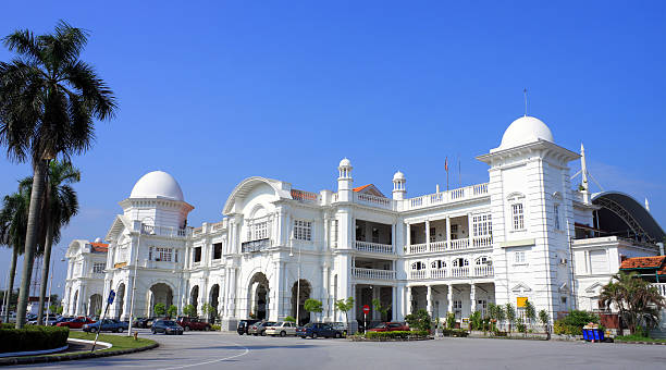 istock Bright white Ipoh railway station against blue sky 149044261