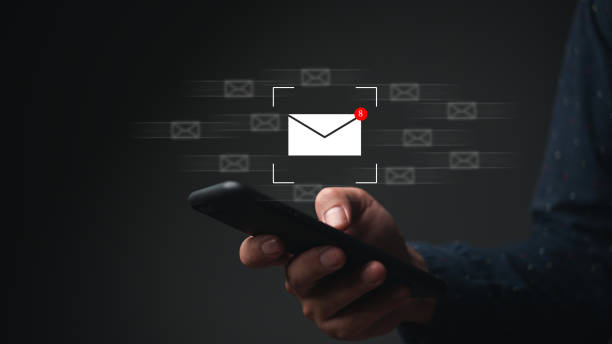 istock businessman using smartphone for email with notification alert to customer, business contact and communication, email icon, email marketing. 1490447276