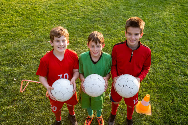 istock portrait of a boys with balls 1490448808