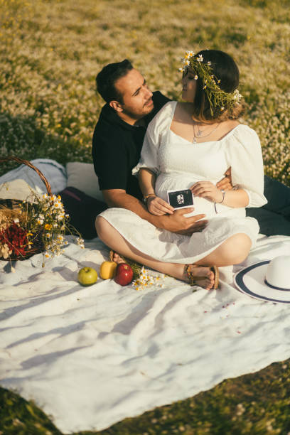 istock Pregnant woman and husband having picnic. 1490448876