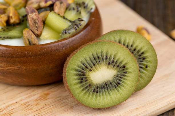 istock green kiwi fruit cut into pieces, close up 1490449947