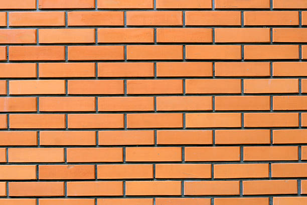 orange brick wall stock photo