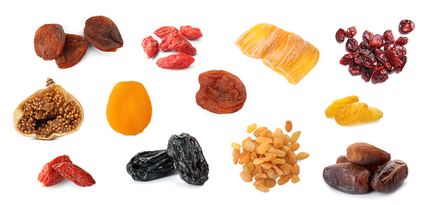 Flat lay (top view) of yellow Raisins isolated on white background.