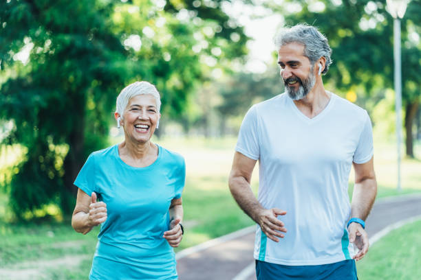istock Senior friends jogging together 1490452607