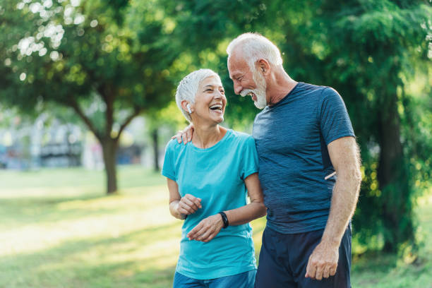 istock Senior friends jogging together 1490452610
