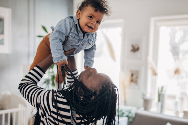 istock Mom holding her baby boy 1490456564