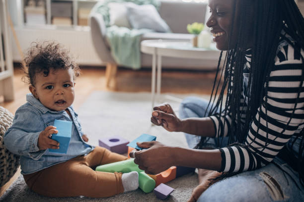 istock Mom playing with her baby 1490457073