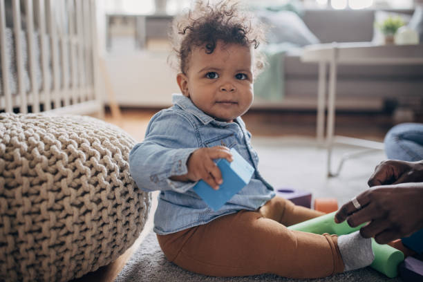 istock Baby boy playing with toys 1490457225