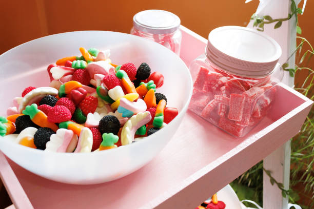 table with lots of sweets in containers for a party with selective focus