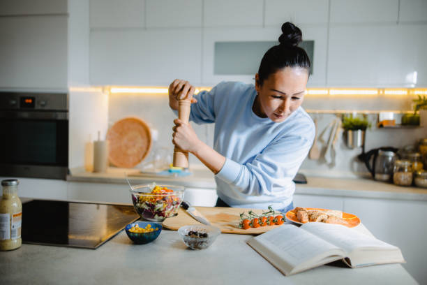 istock Asian female student studying at home 1490464684