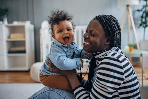 istock Mother holding her baby 1490466564