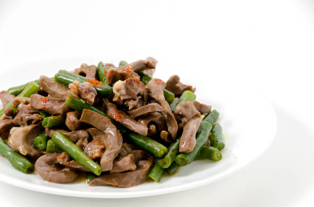 istock stir-fried Pork Heart with green beans on a white background. 1490467071