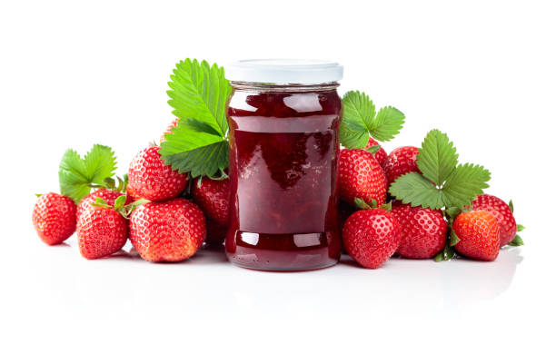 istock Strawberry jam and fresh berries are isolated on a white background. 1490467331