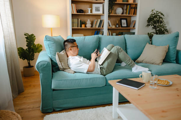 istock Asian male student studying at home 1490467758