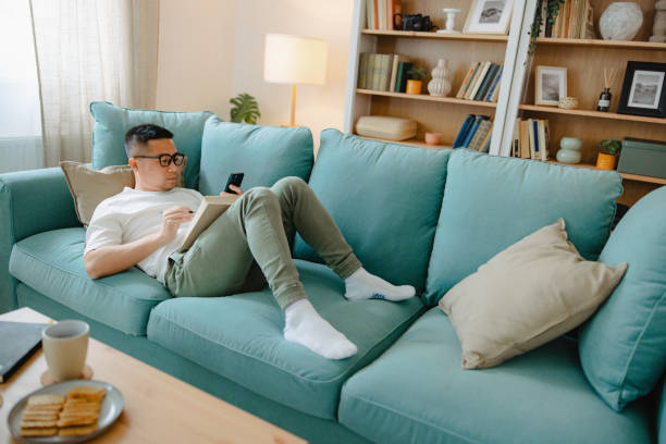 istock Asian male student studying at home 1490467946