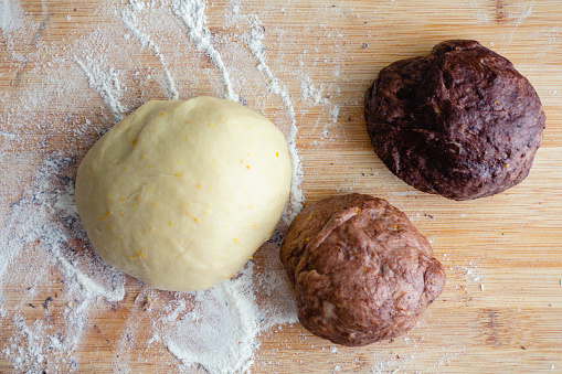 Bread dough that has been colored with cocoa powder with uncolored dough