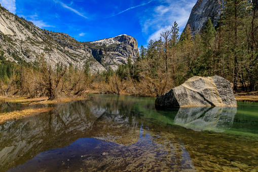 Mirror Lake full after snow melt in the spring, North Dome reflections, in the Yosemite National Park, Sierra Nevada mountain range in California, USA