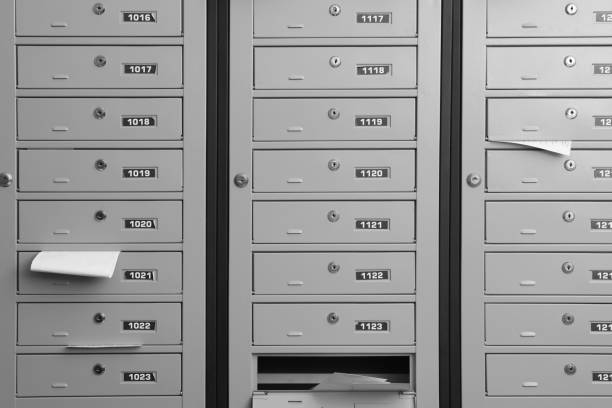 istock Grey metal mailboxes with receipts and envelopes indoors 1490476927