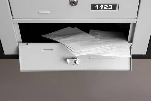 istock Open metal mailbox with envelopes indoors, above view 1490477204