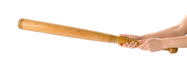 Woman holding baseball bat on white background, closeup