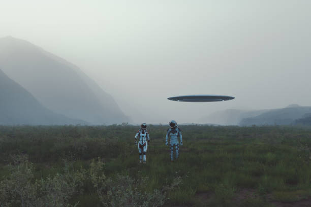 istock Two astronauts walking on lush green exo planet 1490480011
