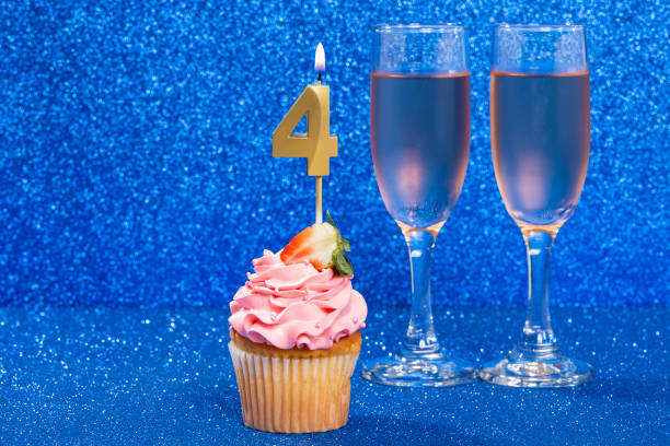 istock Cupcake With Numbers And Glasses With Wine For Birthday Or Anniversary 1490480981