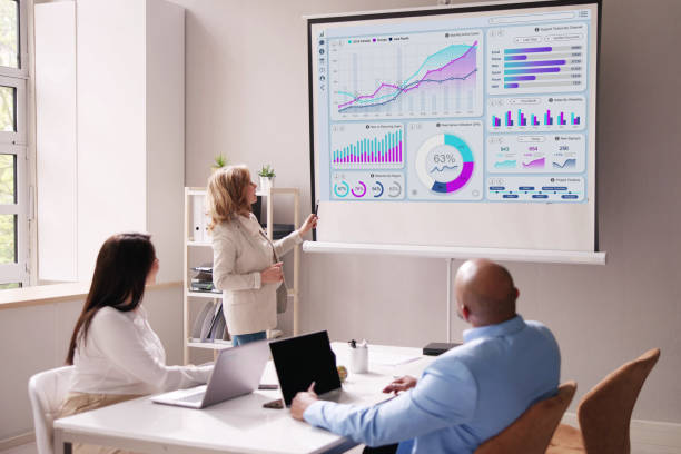 istock Businesspeople Looking At Businessman Giving Presentation 1490481577
