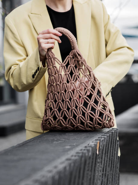 istock woman with a reusable recycling bag. 1490486190