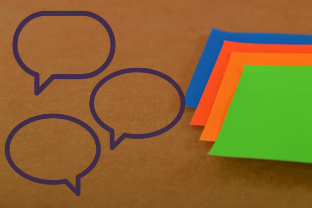 istock Colorful papers with chat bubbles. Digital communication and chat. Concept of social network 1490486909